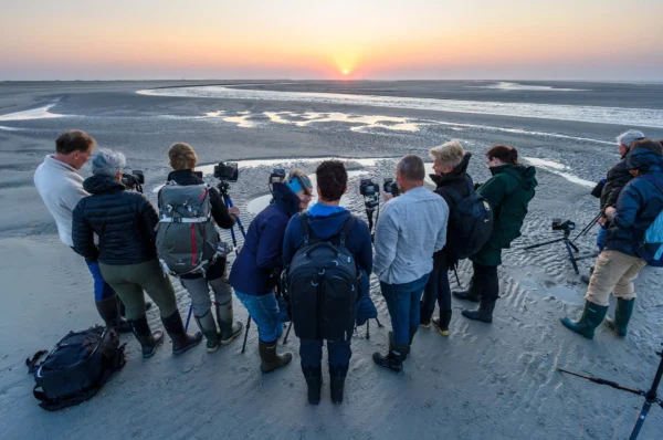 Fotografen op strand Ameland.